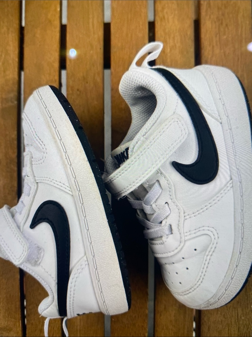 Nike Kids White Sneakers with Black Swoosh